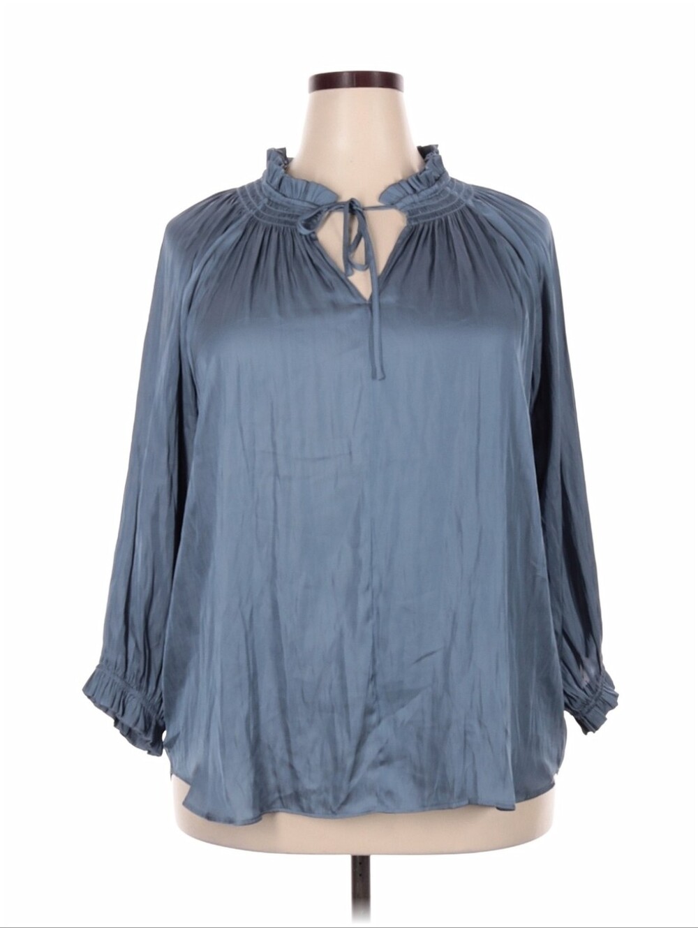Carmen Marc Valvo blouse in a slate blue gray color featuring a ruffled neckline